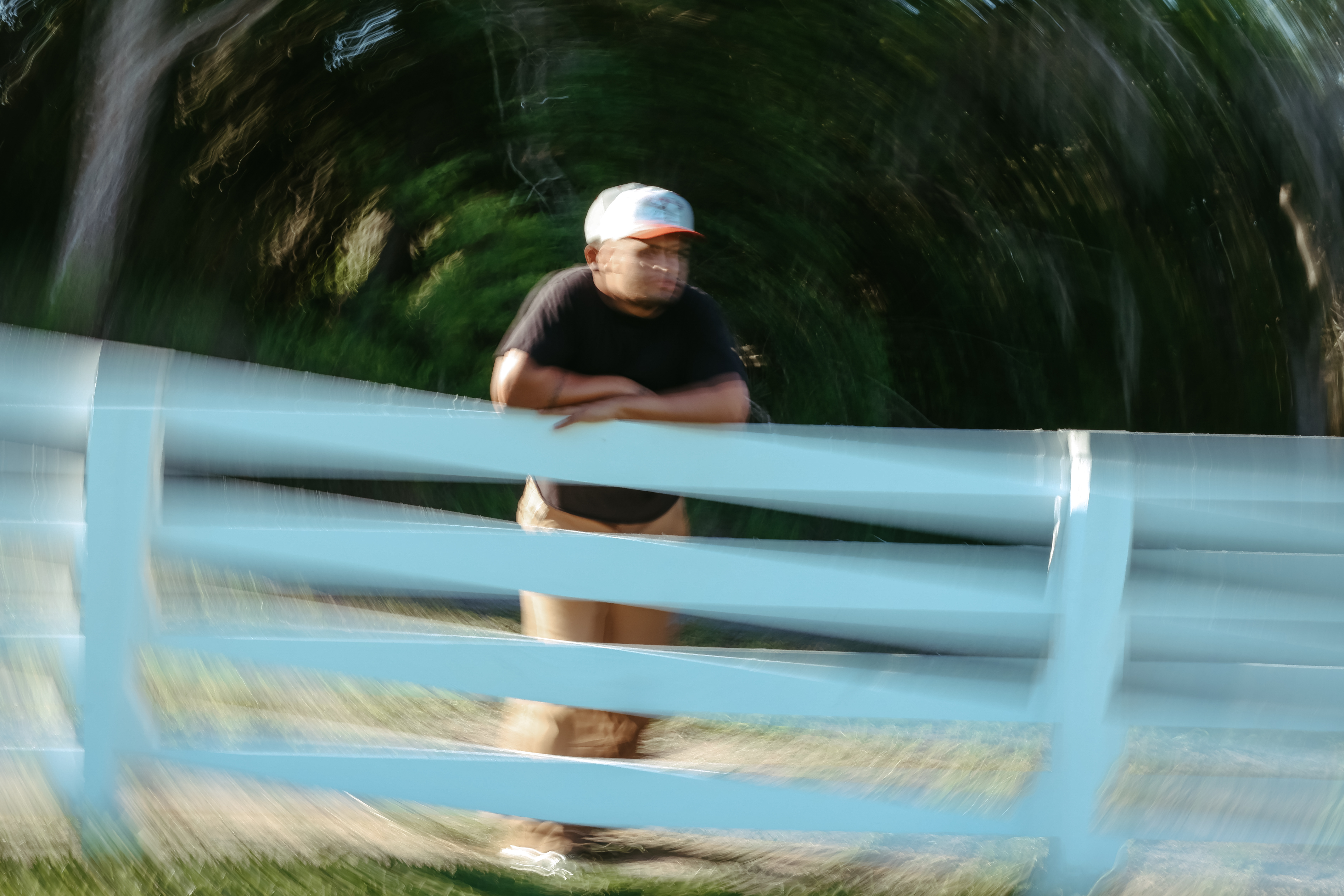 MIK performing into a microphone in an open field